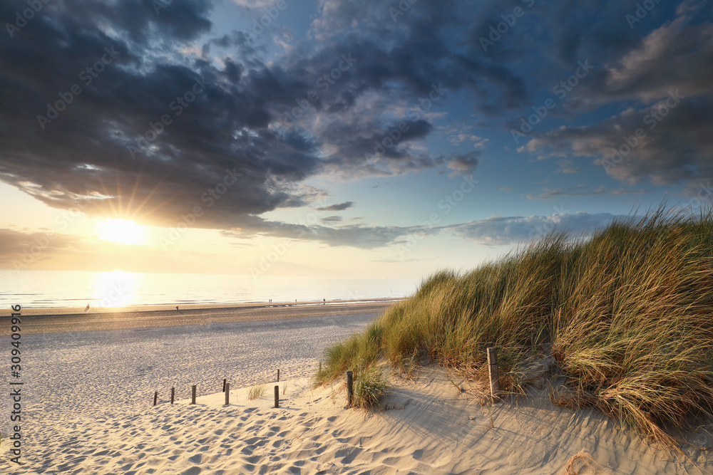 beautiful sunset over sea beach in summer beautiful sunset over sea beach in summer