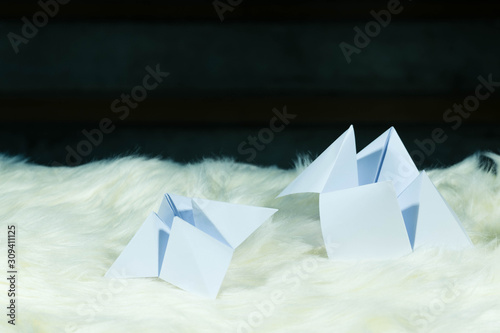 The paper used to predict fate is called Paper Fortune teller. Resting on white fur Ready to be used to predict people's future. Sometimes it is used as a fun game to play. Space for copy space. © Siriroj
