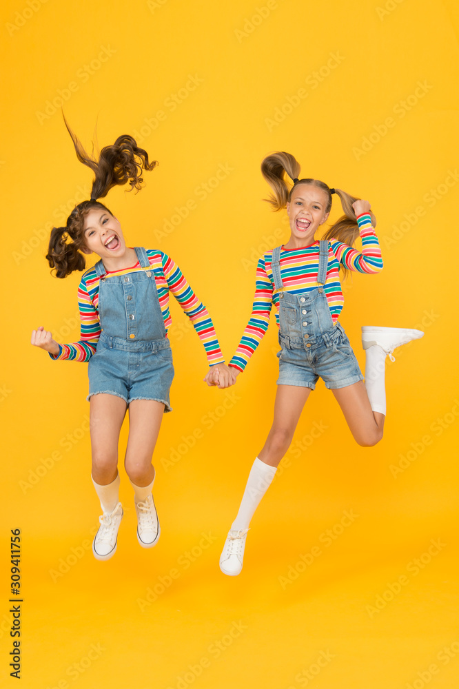 Emotional kids. Fashion shop. Must have accessory. Modern fashion. Kids  fashion. Girls long hair. Cute children same outfits. Trendy and fancy.  Little girls wearing rainbow clothes. Happiness Photos