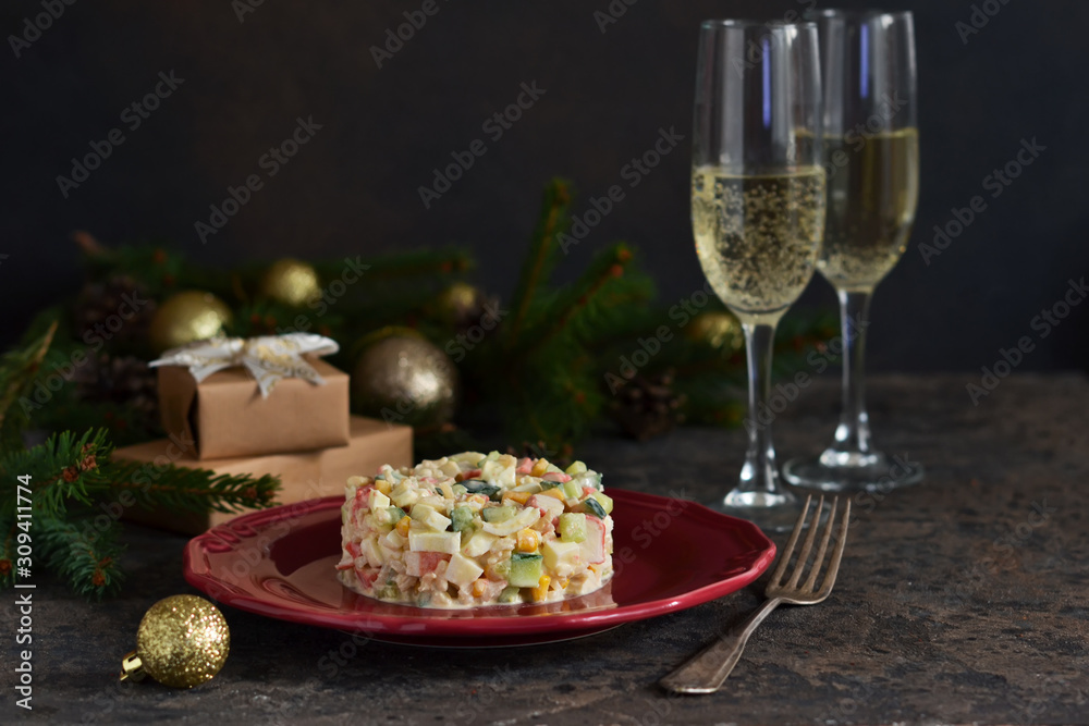 New Year's holiday salad with crab and corn on the table. Horizontal focus.