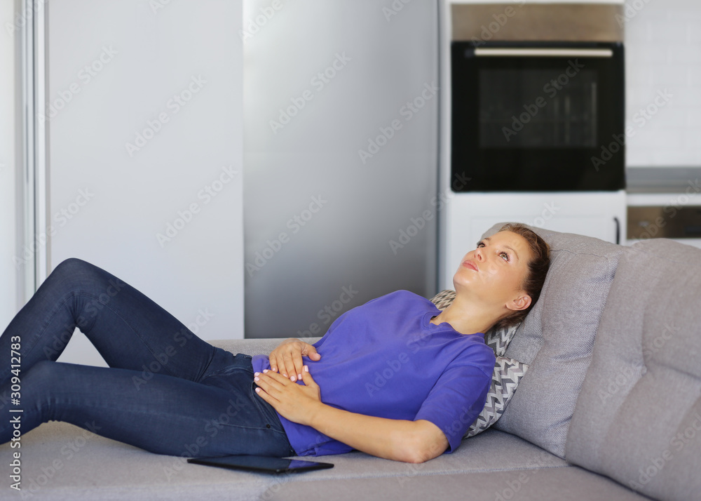 Portrait of young woman suffering from ache.