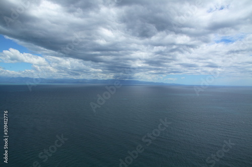 Wallpaper Mural Beautiful marine beach landscapes in New Zealand South Island with turquoise blue and green water and hills with thick lush evergreen vegetation Torontodigital.ca