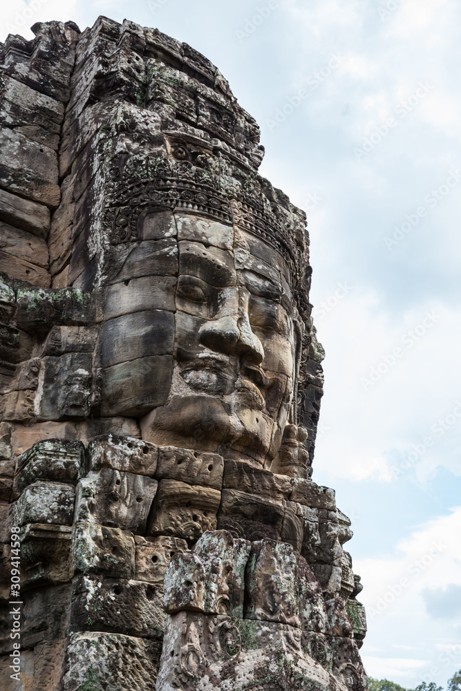 Carved stone faces in Bayon temple in Angkor Thom, Siem Reap province, Cambodia