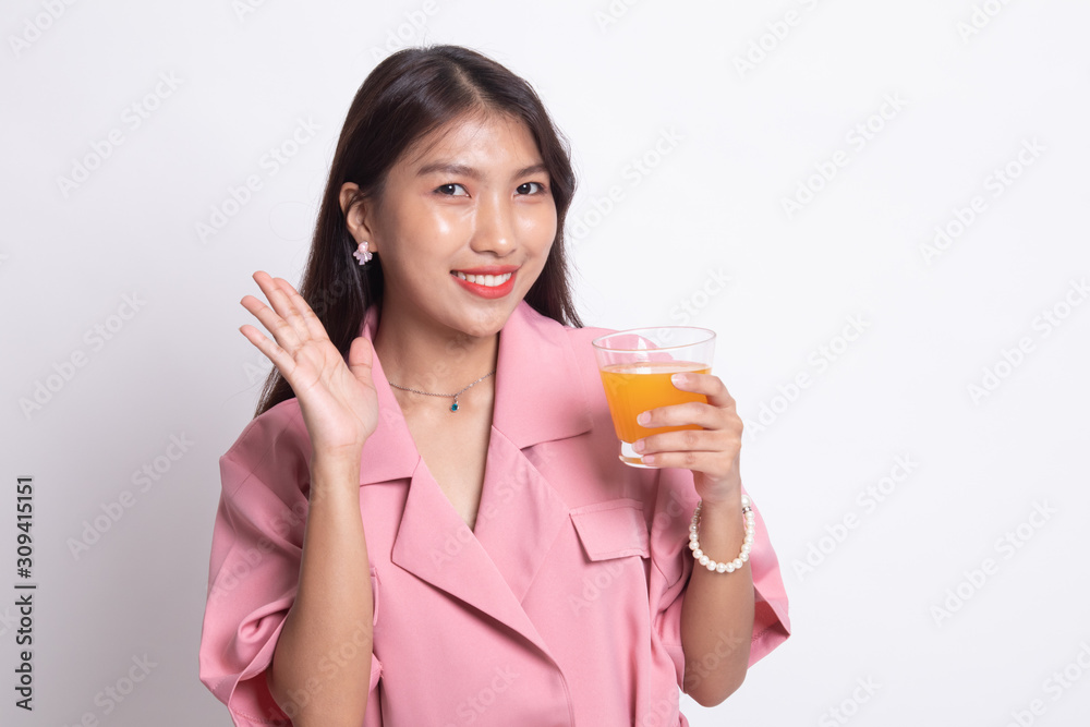 Happy Young Asian woman drink orange juice. Happy Young Asian woman drink orange juice.