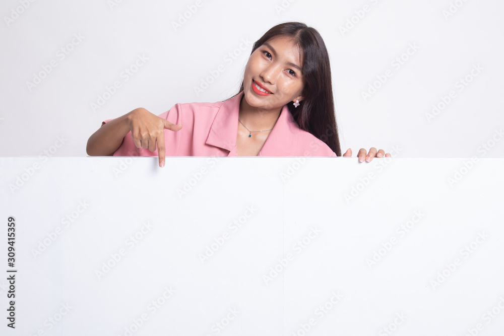 Young Asian woman point to a blank sign. Young Asian woman point to a blank sign.