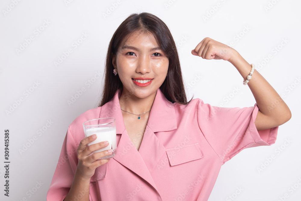 Healthy Asian woman drinking a glass of milk. Healthy Asian woman drinking a glass of milk.
