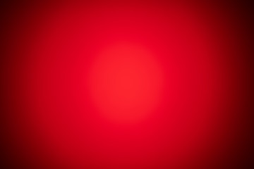 red blurred background with strong black gradient and strong vignette