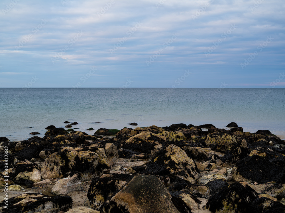 A Horizon and Sea and Exposed Rocks