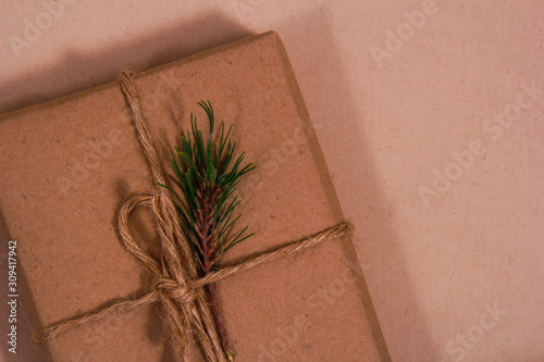 With some pine leaves decorate your Christmas present and make it more beautiful and special. photo