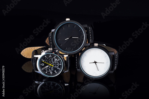 Wrist watch on black background with reflection