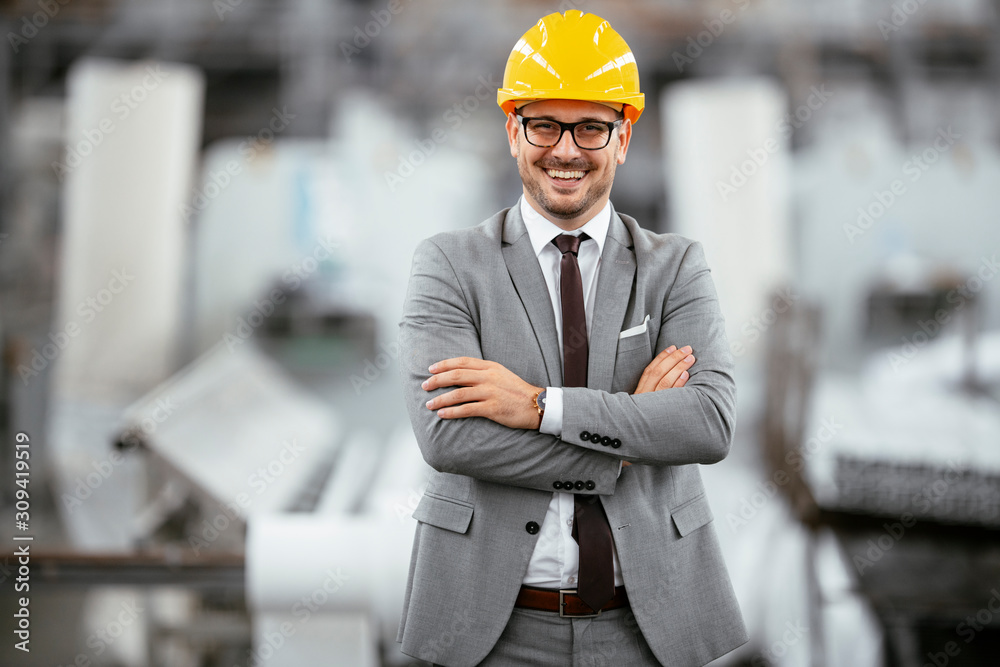 Portrait of successful businessman in factory. Handsome architect in suit. Portrait of successful businessman in factory. Handsome architect in suit.