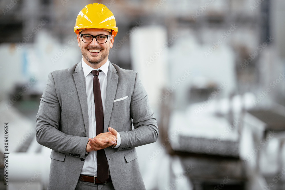 Portrait of successful businessman in factory. Handsome architect in suit. Portrait of successful businessman in factory. Handsome architect in suit.