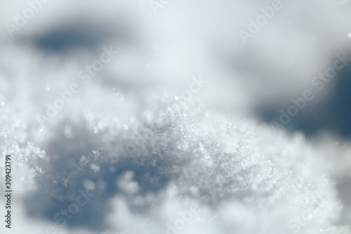 white snow texture with shadows, selected focus, macro photo. © Anastassiya 