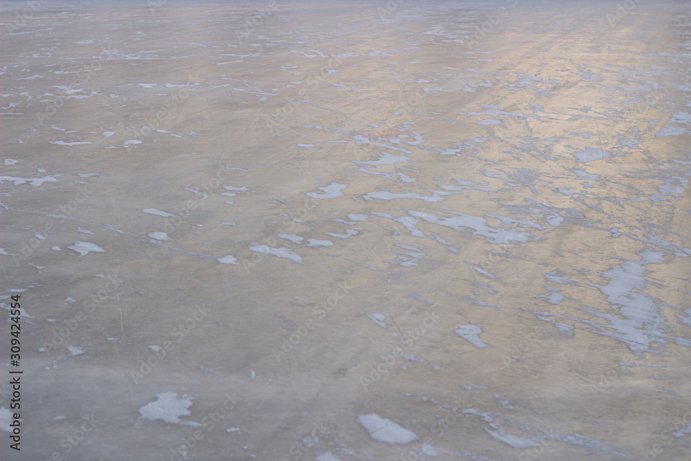 ice background with marks from skating and hockey, blue texture ice background with marks from skating and hockey, blue texture