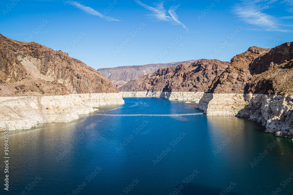 Looking into Lake Meade from the Hoover dam with the bleached high waterline of the dam.