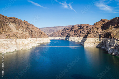 Fototapeta Looking into Lake Meade from the Hoover dam with the bleached high waterline of the dam