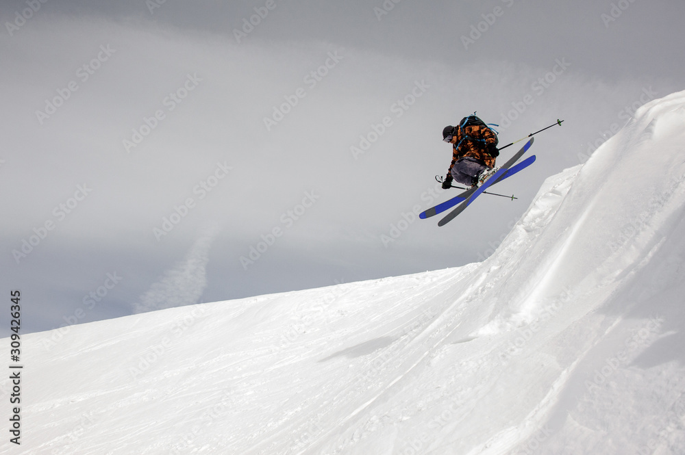 Skier takes off the ground while sliding down