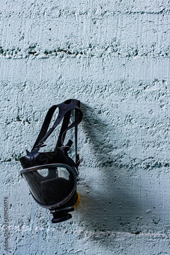 gas mask hanging on a wall