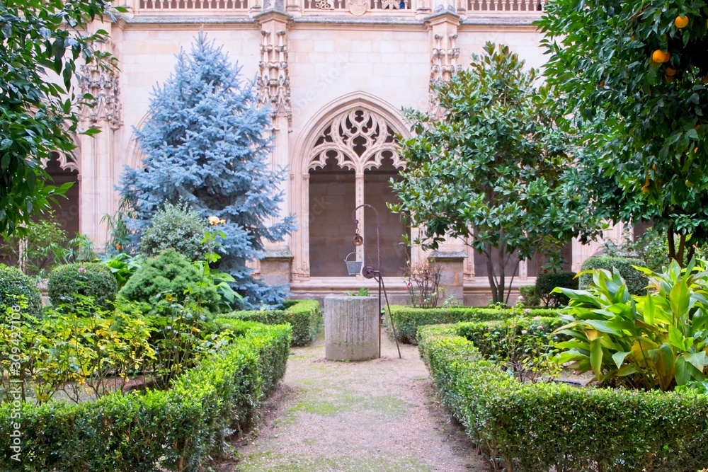 San Juan de los Reyes  monastery garden well in Toledo spain