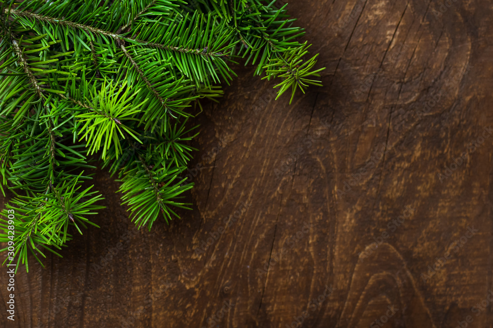 Green spruce twig old wooden background. Top view. Green spruce twig old wooden background. Top view.