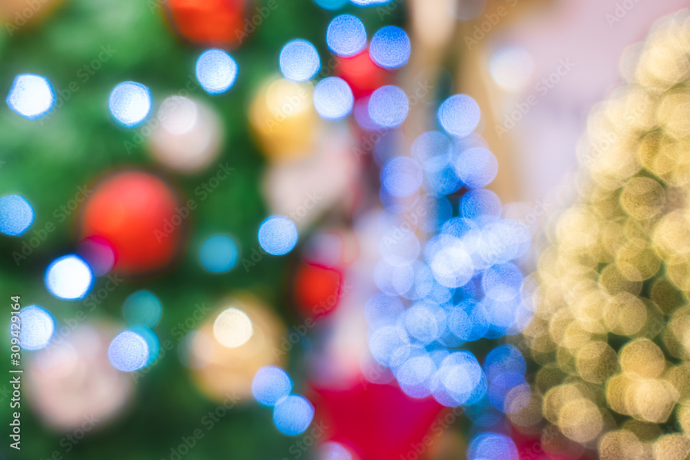 Blurry background of beautiful Christmas light bokeh on Christmas tree