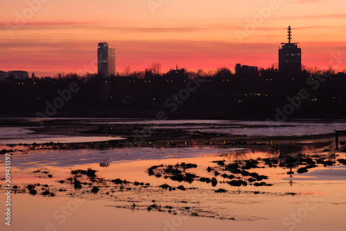 Sunset over Floreasca lake in Bucharest, Romania photo