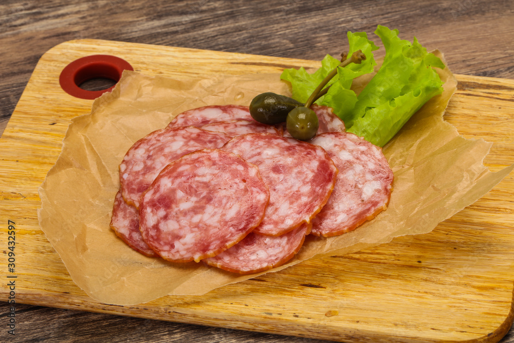 Spanish Salchichon sausage with salad Spanish Salchichon sausage with salad