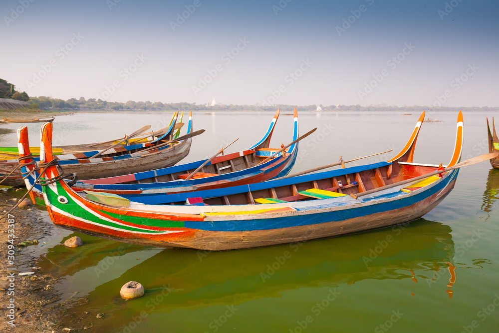 Myanmar.  Landscape. Boats in lake. Trash