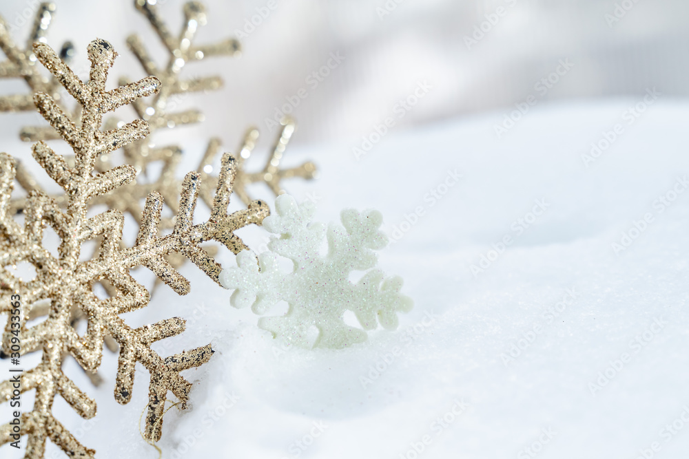 Christmas of  winter - Christmas Snowflakes on snow, Winter holidays concept. White and Golden Snowflakes decorations In Snow Background