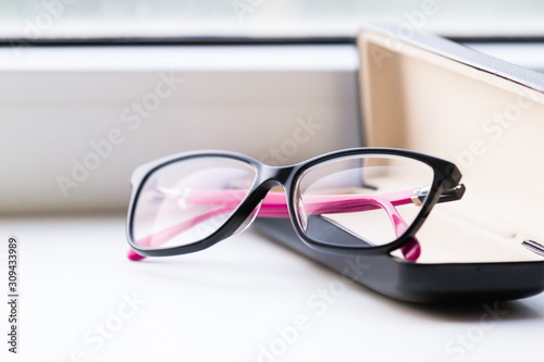 Glasses, white background, leather case