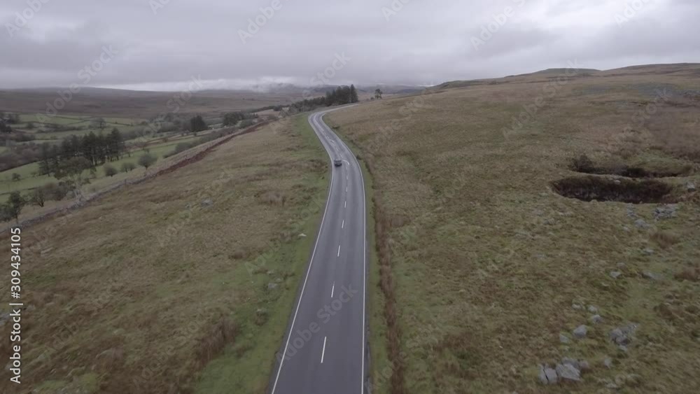 Aerial view of countryside road in Wales on a cloudy day Aerial view of countryside road in Wales on a cloudy day