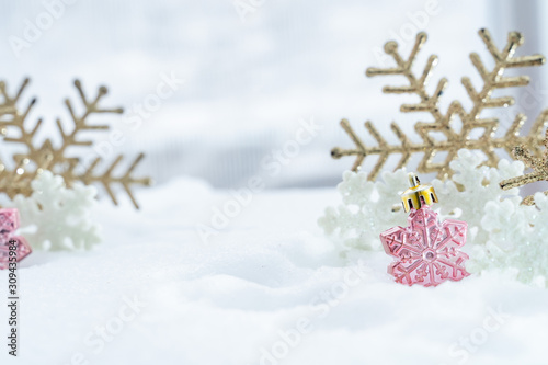 Christmas of winter - Christmas Snowflakes on snow, Winter holidays concept. White and Golden Snowflakes decorations In Snow Background