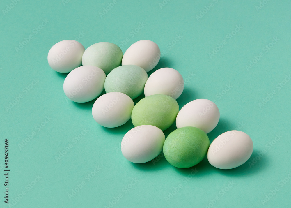 Easter egg pattern in a light green tones on a turquoise background. Easter egg pattern in a light green tones on a turquoise background.