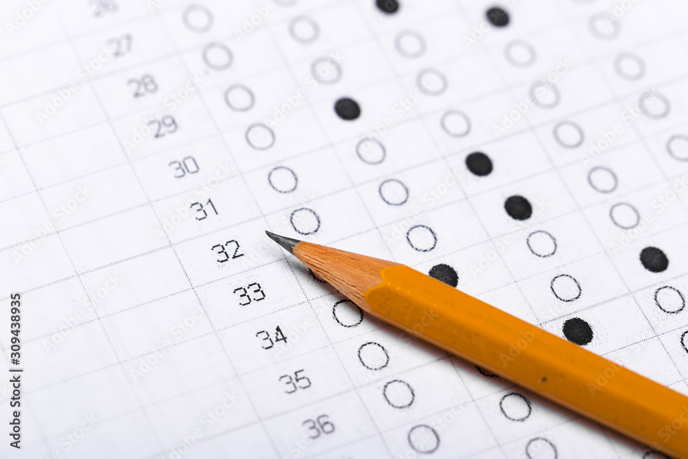 testing in exercise and exam paper. computer sheet with pencil in school test room, education concept testing in exercise and exam paper. computer sheet with pencil in school test room, education concept