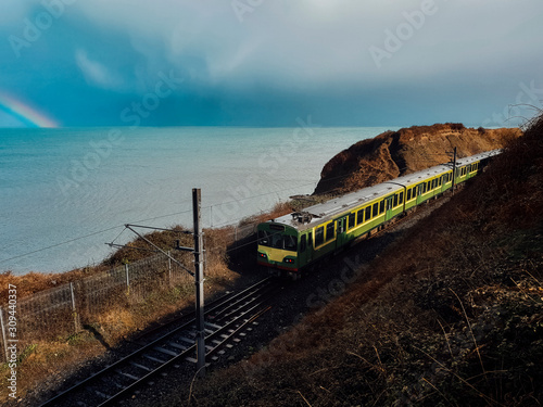 Train Travelling on a Scenic Landscape of Ireland . Stock Picture photo