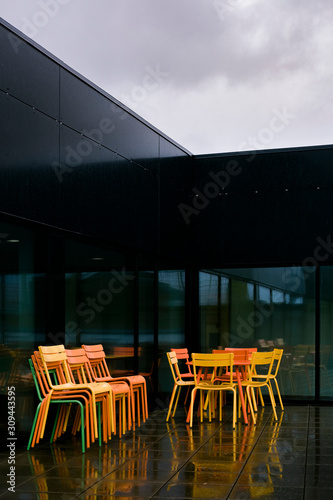 Colourful chairs in the rain photo