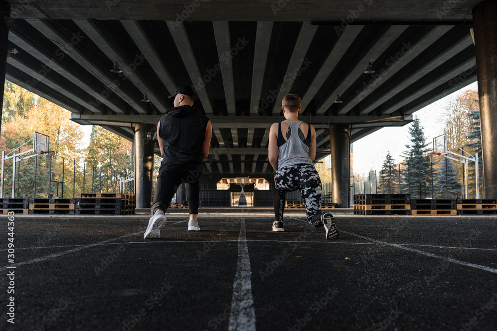 Working out couple under bridge Working out couple under bridge