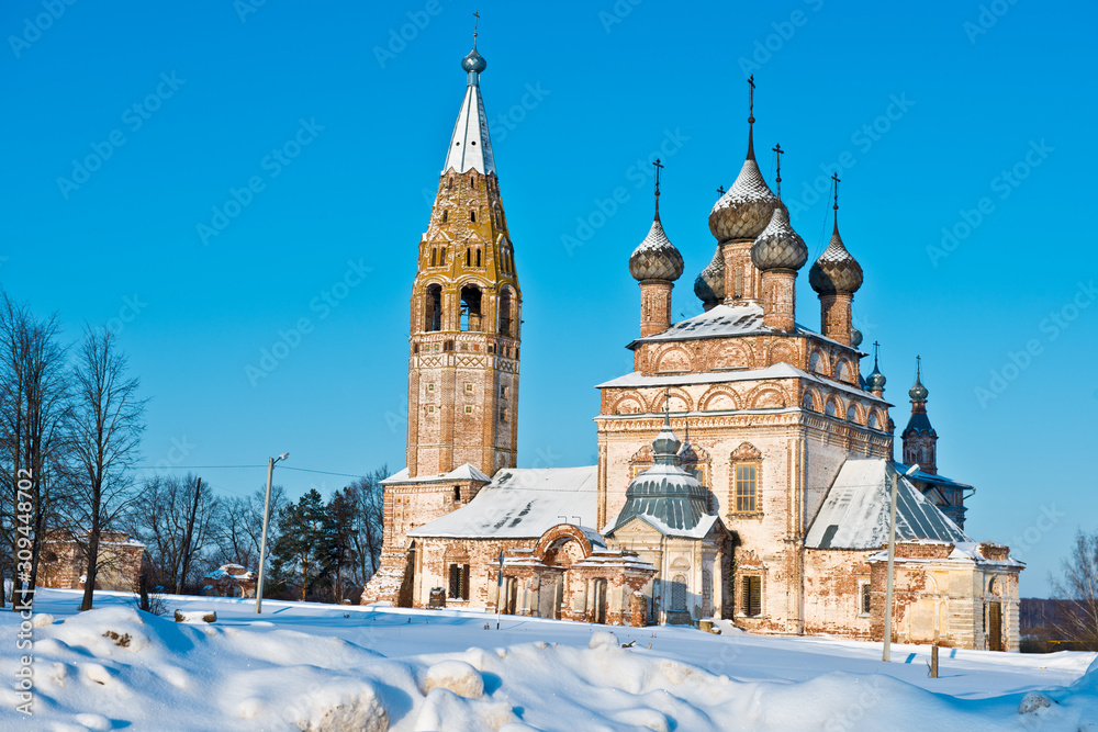 Winter landscape with a view of the Temple complex of churches of the Beheading of St. John the Baptist and Ascension/ village Parskoe/ Rodnikovsky district/ Ivanovo region/ Russia.
