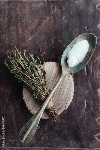 vintage spoon of salt and a bunch of thyme