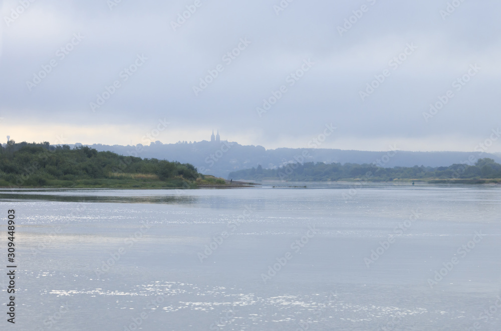 Obraz premium The summer morning landscape at the river.