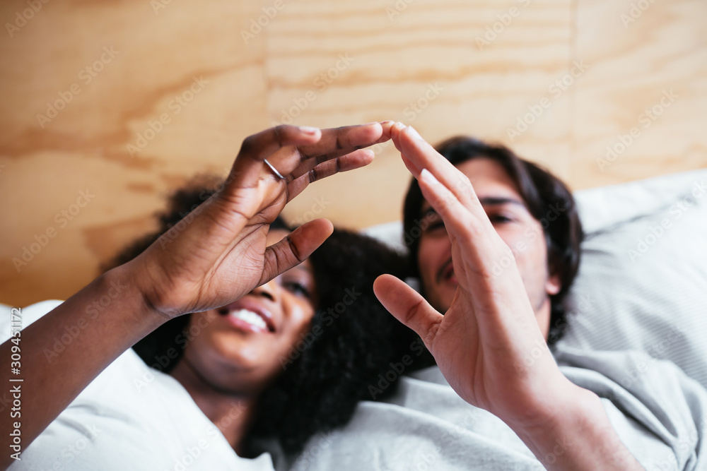 Multiethnic lovers on bedroom. Multiethnic lovers on bedroom.