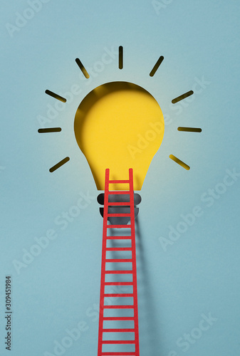 Lightbulb with a ladder representing an idea photo