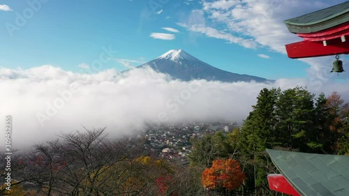 Aerial view 4k Video of Mount Fuji and mist view from behind Chureito Pagoda, Yamanashi, Japan. photo