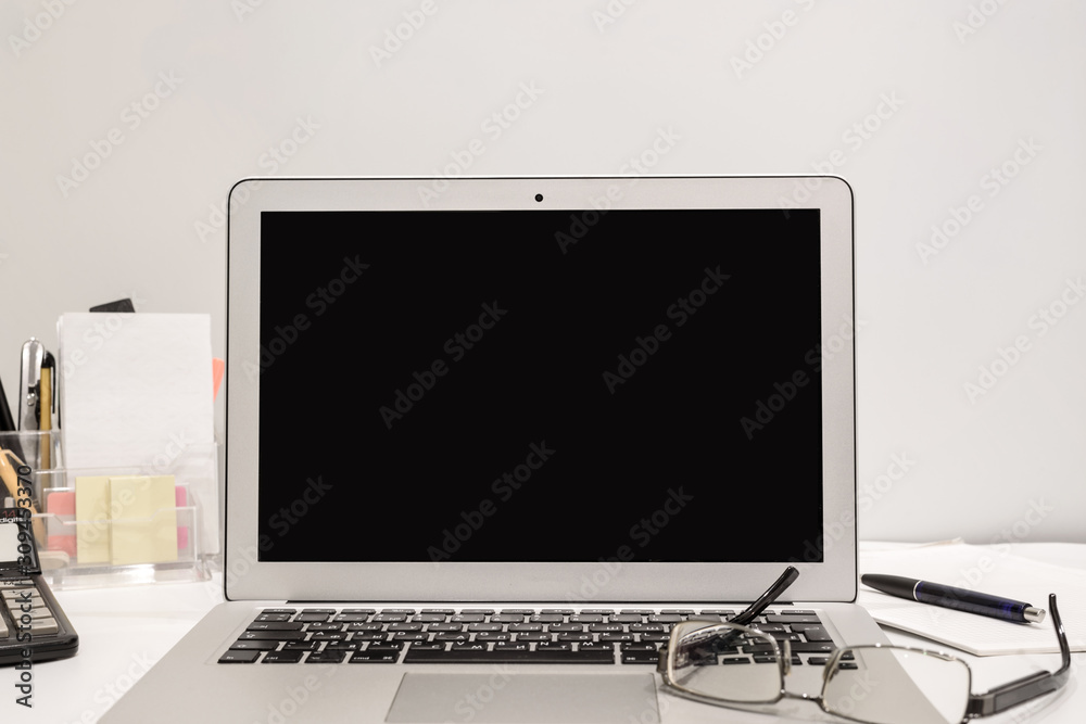Business still life with computer, glasses, calculator and office supplies Business still life with computer, glasses, calculator and office supplies