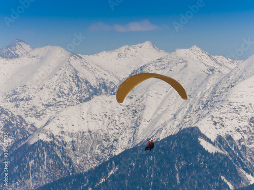 Mountain winter, paraglider