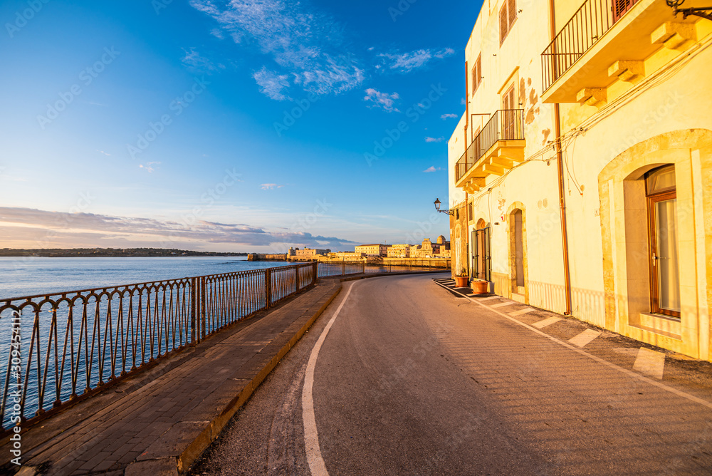 narrow street at sunrise