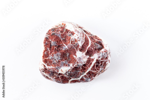 Mineral stone close-up isolated on a white background. A piece of granite or stone on a white background