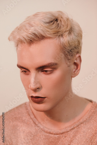 Sensual gay man with beautiful makeup