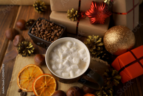 Christmas holidays. Hot coffee with marshmallows and chestnuts. 