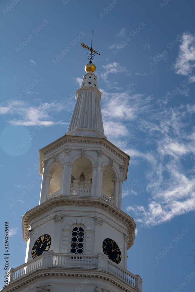 White steeple with blue sky